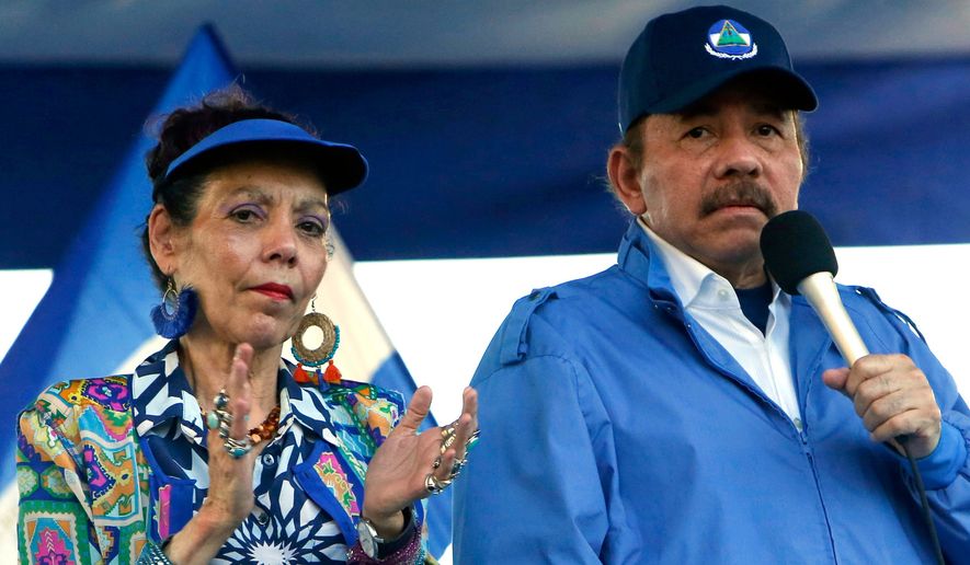 FILE - President Daniel Ortega and his wife, Vice President Rosario Murillo, lead a rally in Managua, Nicaragua, Sept. 5, 2018. (AP Photo/Alfredo Zuniga, File)