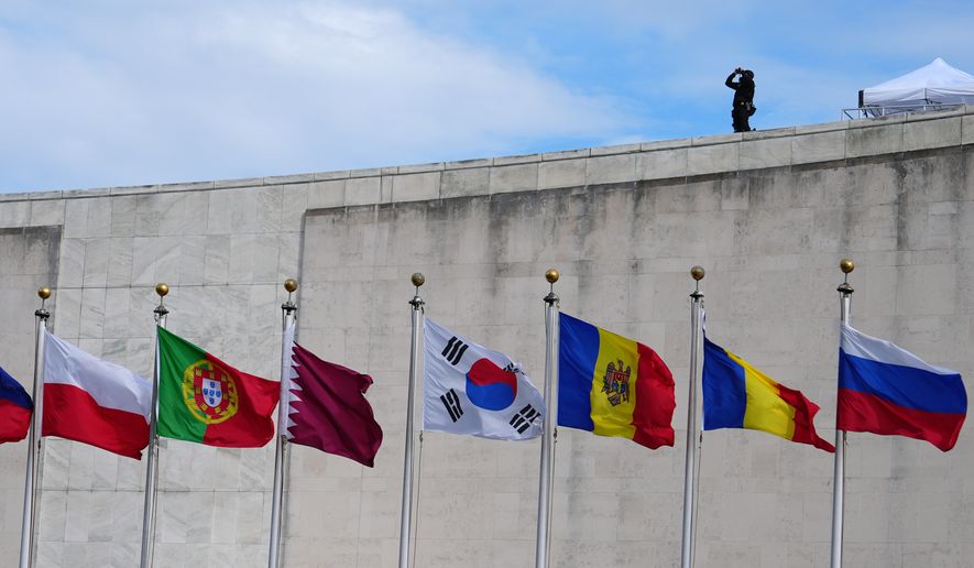 Flags fly at the United Nations Tuesday, Sept. 22, 2026, at the UN headquarters, as security keeps watch. (AP Photo/Julia Demaree Nikhinson)