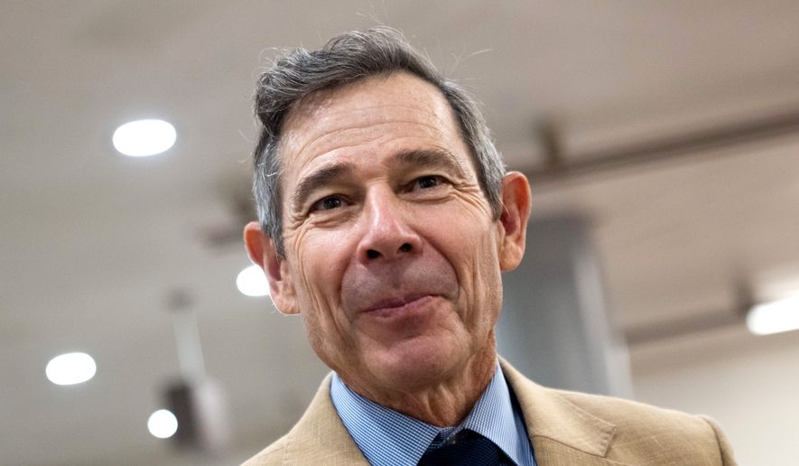 Sen. John Curtis, R-Utah, walks through the Capitol during votes in Washington, July 16, 2026. (AP Photo/Allison Robbert, File)