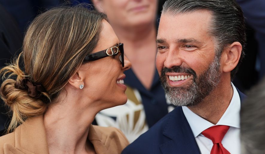 Donald Trump Jr. speaks with his wife, Bettina, left, as they wait for President Donald Trump to deliver remarks to U.S. Embassy staff at Deerfield Residence in Dublin, Sept. 12, 2026. (AP Photo/Julia Demaree Nikhinson, File)