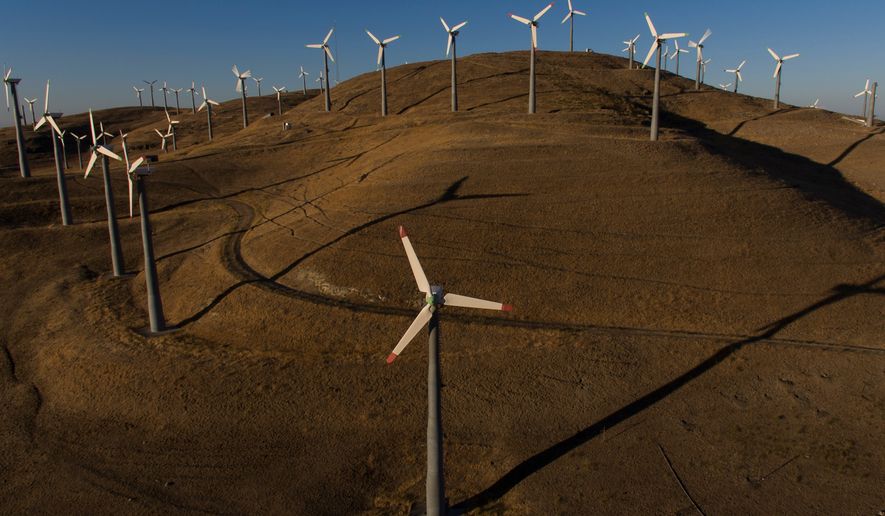 FILE - Wind turbines can be seen from Patterson Pass Road in Livermore, Calif., Wednesday, Aug. 10, 2022. (AP Photo/Godofredo A. Vásquez, File))