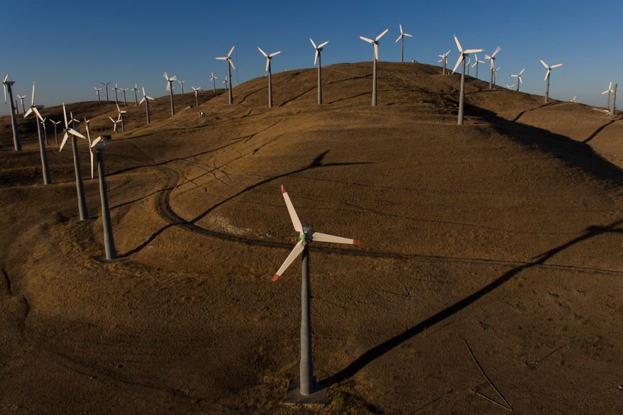 FILE - Wind turbines can be seen from Patterson Pass Road in Livermore, Calif., Wednesday, Aug. 10, 2022. (AP Photo/Godofredo A. Vásquez, File))