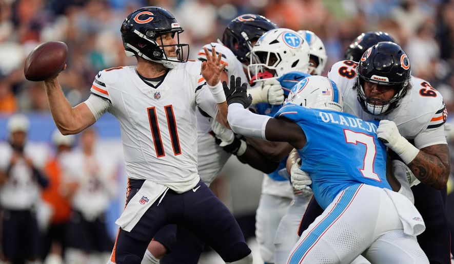 Chicago Bears quarterback Case Keenum throws under pressure against the Tennessee Titans during the second half of a preseason NFL football game, Saturday, Aug. 29, 2026, in Nashville, Tenn. (AP Photo/George Walker IV)