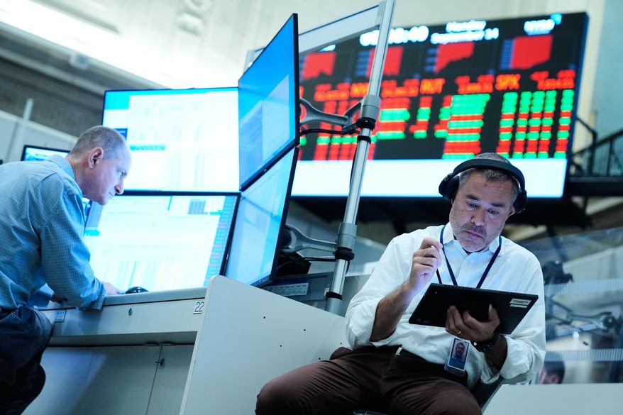Justin Kanda works on the floor at the New York Stock Exchange in New York, Monday, Sept. 14, 2026. (AP Photo/Seth Wenig)