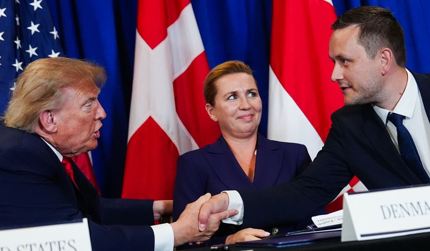 President Donald Trump, left, shakes hands with Greenland's Prime Minister Jens-Frederik Nielsen, right, as Denmark's Prime Minister Mette Frederiksen, center, watches at a security agreement signing ceremony during the United Nations General Assembly, Tuesday, Sept. 22, 2026, at the UN headquarters. (AP Photo/Julia Demaree Nikhinson, File)