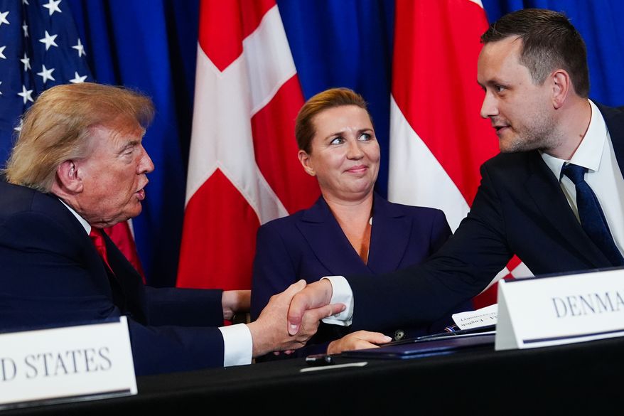 President Donald Trump, left, shakes hands with Greenland's Prime Minister Jens-Frederik Nielsen, right, as Denmark's Prime Minister Mette Frederiksen, center, watches at a security agreement signing ceremony during the United Nations General Assembly, Tuesday, Sept. 22, 2026, at the UN headquarters. (AP Photo/Julia Demaree Nikhinson, File)