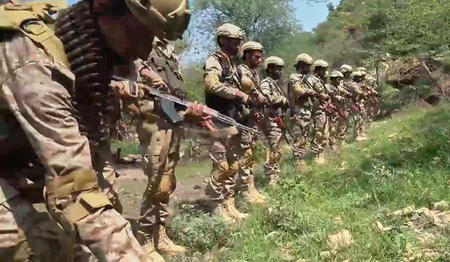 This image taken from undated video released by the Ansar Allah Media Office, the media arm of Yemen's Houthi rebels, on Tuesday, Sept. 22, 2026, shows what the group says are Houthi fighters standing in formation in an area of clashes with Saudi-backed forces in Yemen. (Ansar Allah Media Office via AP)