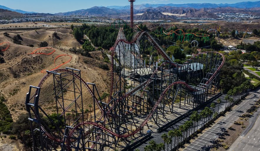 This aerial view shows the X2 roller coaster at Six Flags Magic Mountain in Valencia, Calif., Wednesday, Sept. 23, 2026. (AP Photo/Jae C. Hong)