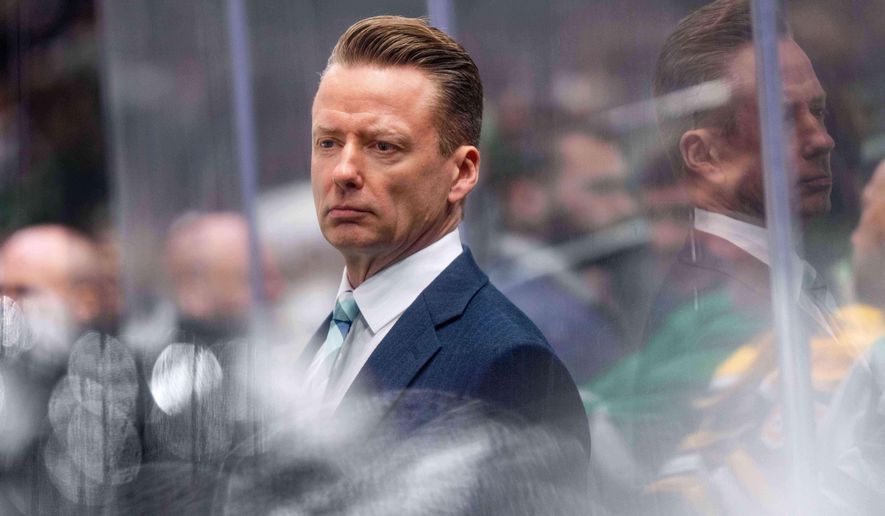 Dallas Stars head coach Glen Gulutzan watches from the bench during the third period of an NHL hockey game against the Boston Bruins, Jan. 20, 2026, in Dallas. (AP Photo/Jeffrey McWhorter, File)