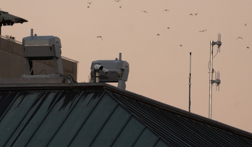 Drones stations are pictured on a federal building near the White House,Wednesday, Sept. 16, 2026, in Washington. (AP Photo/Allison Robbert)