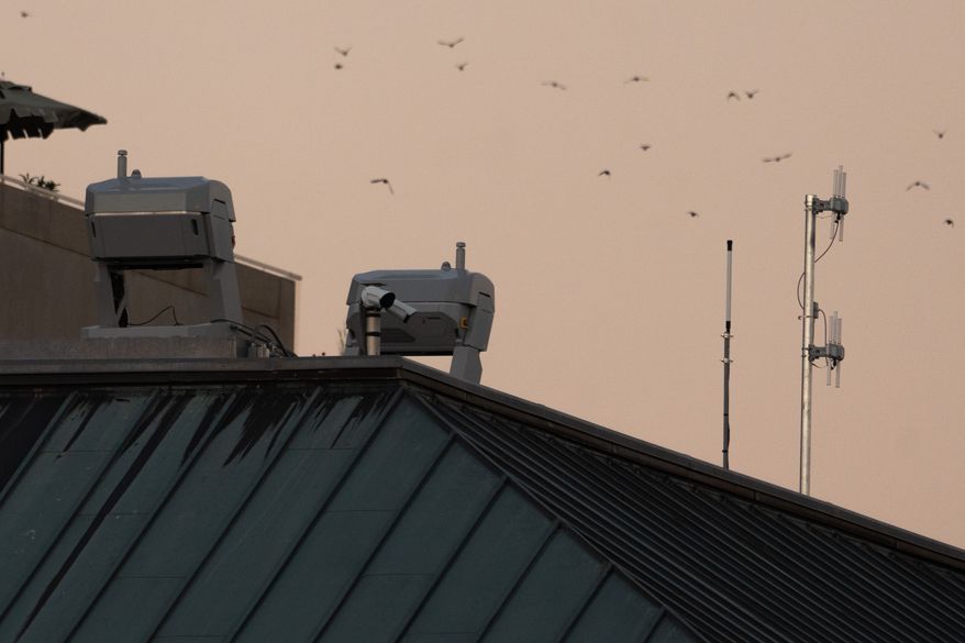 Drones stations are pictured on a federal building near the White House,Wednesday, Sept. 16, 2026, in Washington. (AP Photo/Allison Robbert)