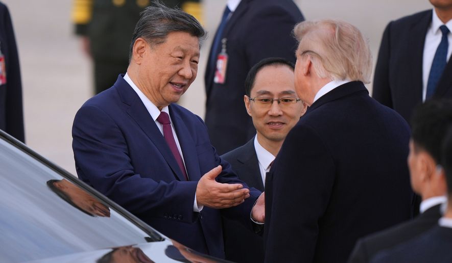 President Donald Trump and Chinese President Xi Jinping talk together at Joint Base Andrews, Md., Wednesday, Sept. 23, 2026. (AP Photo/Mark Schiefelbein)