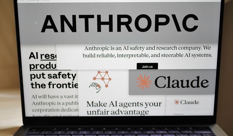 Pages from the Anthropic website and the company's logos are displayed on a computer screen in New York, Feb. 26, 2026. (AP Photo/Patrick Sison, File)