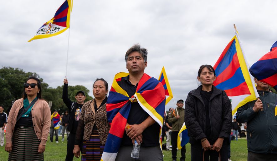 Pro-Tibet independence protestors demonstrate near the U.S. Capitol while China's President Xi Jinping visits the White House, Thursday, Sept. 24, 2026, in Washington. (AP Photo/Allison Robbert)