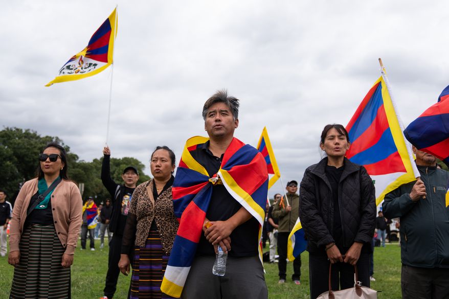 Pro-Tibet independence protestors demonstrate near the U.S. Capitol while China's President Xi Jinping visits the White House, Thursday, Sept. 24, 2026, in Washington. (AP Photo/Allison Robbert)