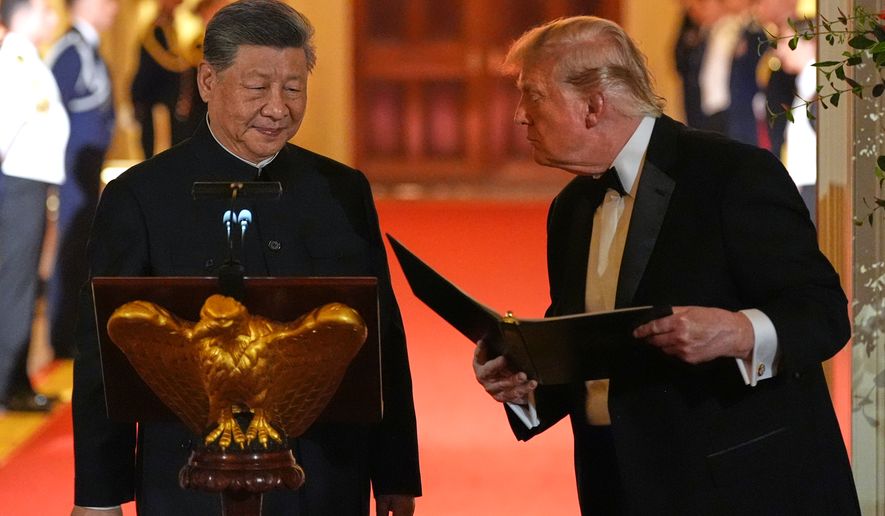 President Donald Trump talks with China's President Xi Jinping during a State Dinner in the East Room of the White House, Thursday, Sept. 24, 2026, in Washington. (AP Photo/Alex Brandon)