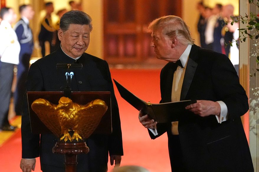 President Donald Trump talks with China's President Xi Jinping during a State Dinner in the East Room of the White House, Thursday, Sept. 24, 2026, in Washington. (AP Photo/Alex Brandon)