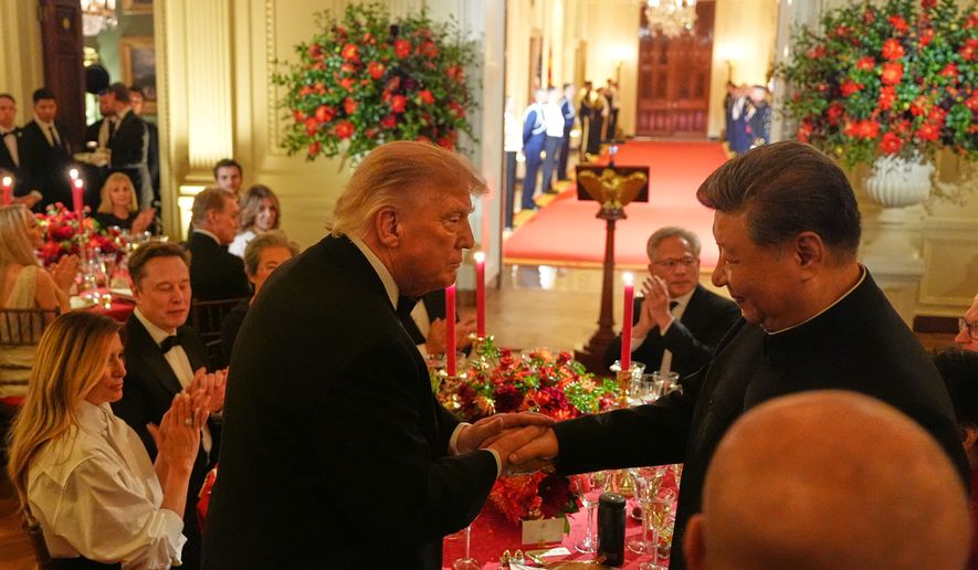 President Donald Trump shakes hands with China's President Xi Jinping in the East Room of the White House during a State Dinner, Thursday, Sept. 24, 2026, in Washington. (AP Photo/Alex Brandon)