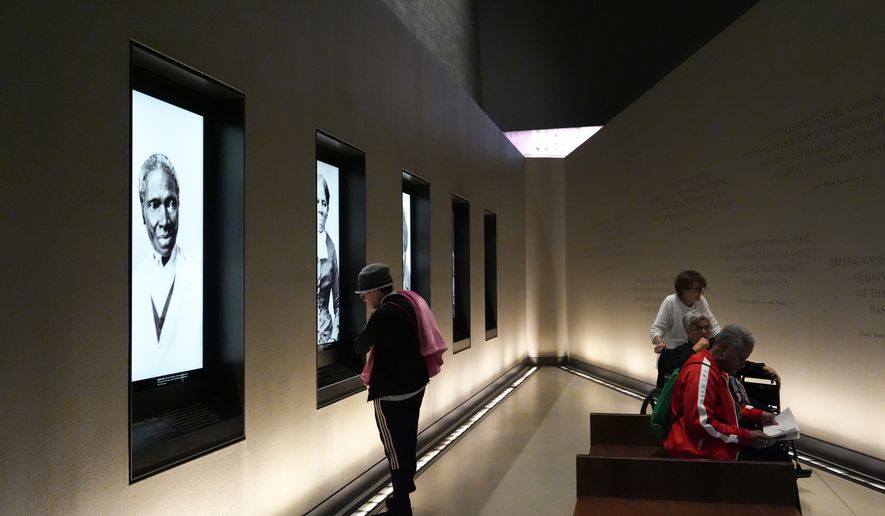 People visit the Smithsonian's National Museum of African American History and Culture, Wednesday, Sept. 23, 2026, in Washington. (AP Photo/Julia Demaree Nikhinson)