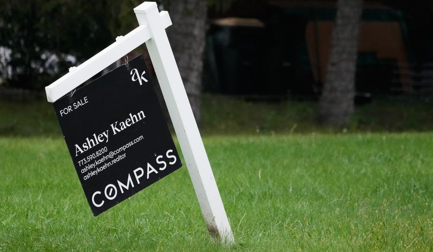For sale sign is seen outside of a home in Arlington Heights, Ill., Wednesday, Sept. 16, 2026. (AP Photo/Nam Y. Huh)