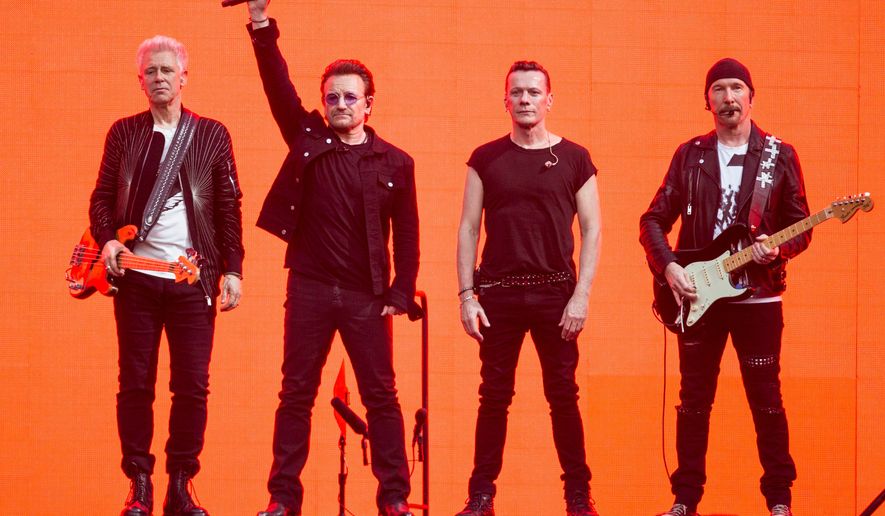 Adam Clayton, from left, Bono, Larry Mullen Jr. and The Edge, of the band U2, perform on stage at Twickenham Stadium in London on July 9, 2017. (Photo by Joel Ryan/Invision/AP, File)