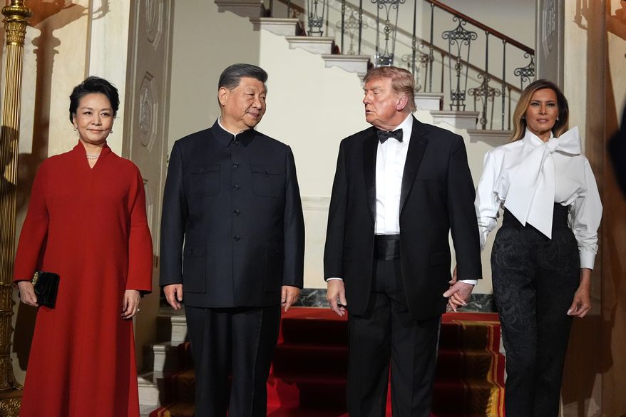 President Donald Trump and first lady Melania Trump pose for a photo with China's President Xi Jinping and his wife Peng Liyuan in the Grand Foyer of the White House during a State Dinner, Thursday, Sept. 24, 2026, in Washington. (AP Photo/Alex Brandon)