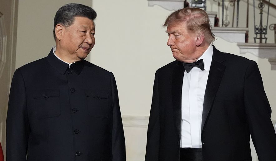 President Donald Trump and China's President Xi Jinping walk in the Grand Foyer of the White House during a State Dinner, Thursday, Sept. 24, 2026, in Washington. (AP Photo/Alex Brandon)