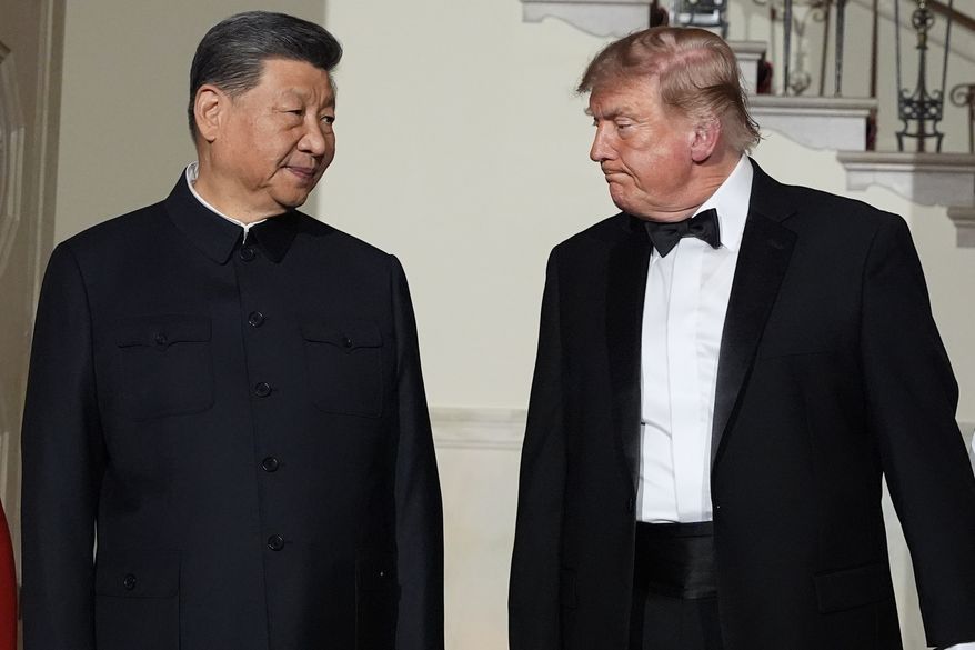 President Donald Trump and China's President Xi Jinping walk in the Grand Foyer of the White House during a State Dinner, Thursday, Sept. 24, 2026, in Washington. (AP Photo/Alex Brandon)