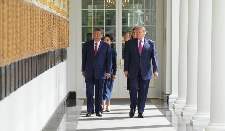 President Donald Trump and China's President Xi Jinping, along with first lady Melania Trump and Peng Liyuan walk along the Colonnade of the White House, Thursday, Sept. 24, 2026, in Washington. (AP Photo/Jacquelyn Martin)