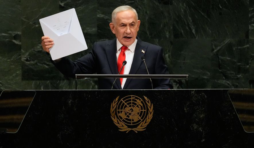 Israeli Prime Minister Benjamin Netanyahu holds up a Starlink satellite internet dish a he speaks during the 81st session of the United Nations General Assembly at United Nations headquarters, Thursday, Sept. 24, 2026. (AP Photo/Seth Wenig)