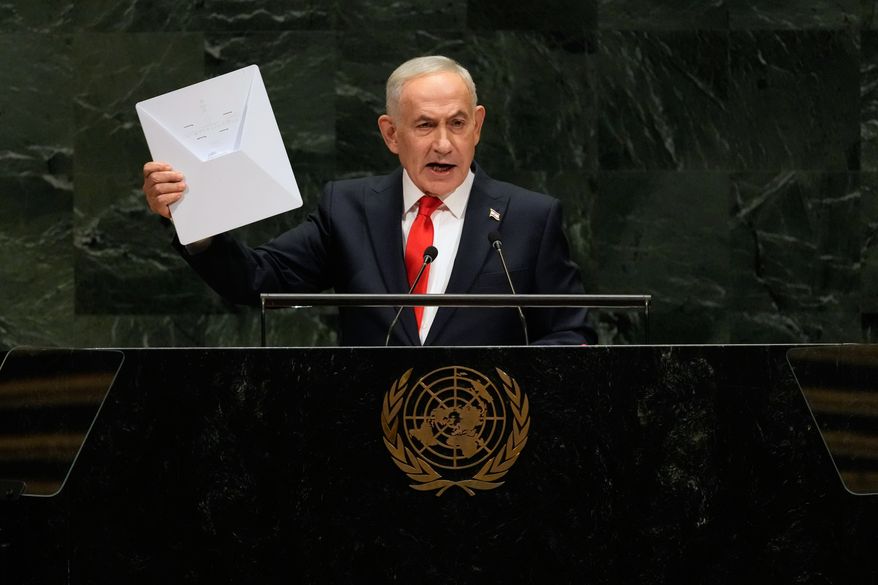 Israeli Prime Minister Benjamin Netanyahu holds up a Starlink satellite internet dish a he speaks during the 81st session of the United Nations General Assembly at United Nations headquarters, Thursday, Sept. 24, 2026. (AP Photo/Seth Wenig)