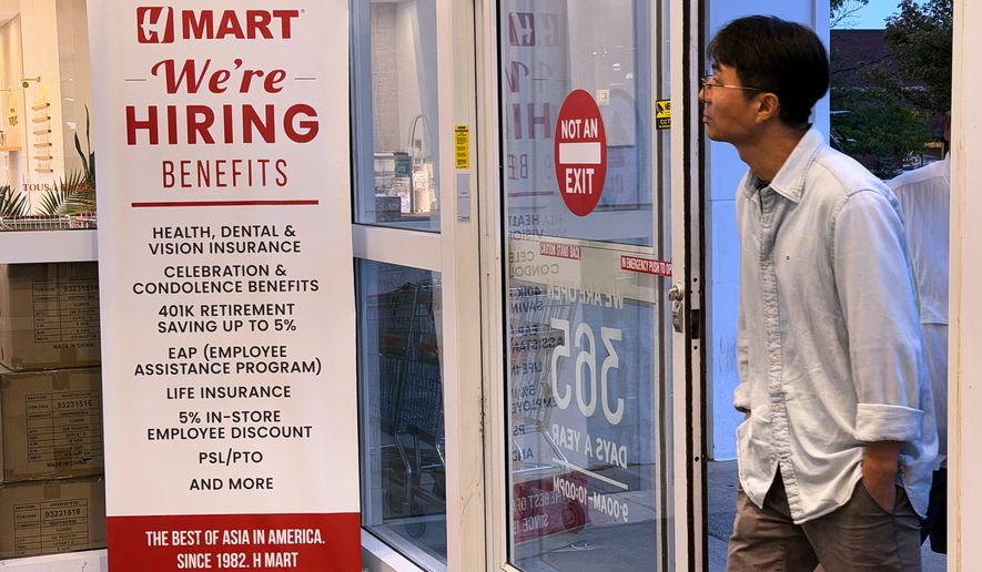 A hiring sign is displayed at a grocery store, in Schaumburg, Ill., Wednesday, Sept. 16, 2026. (AP Photo/Nam Y. Huh)
