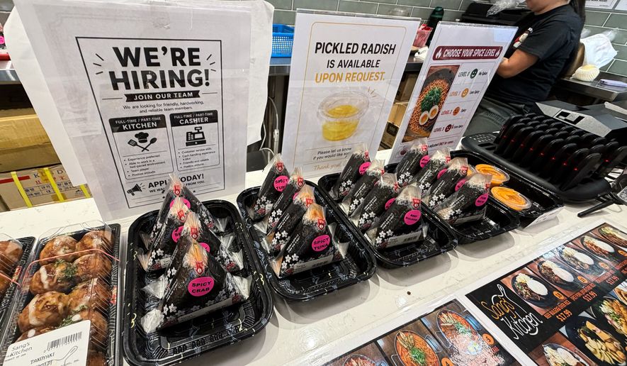 A hiring sign is displayed at a food court in a grocery store, in Schaumburg, Ill., Wednesday, Sept. 16, 2026. (AP Photo/Nam Y. Huh)