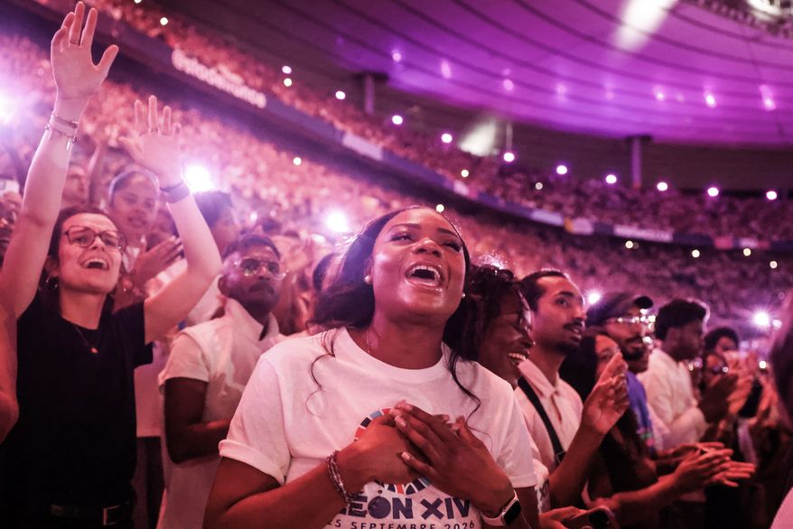 Faithful cheer Pope Leo XIV at the Stade de France in Saint-Denis near Paris during a prayer vigil with young people, Friday, Sept. 25, 2026. (AP Photo/Thomas Padilla)