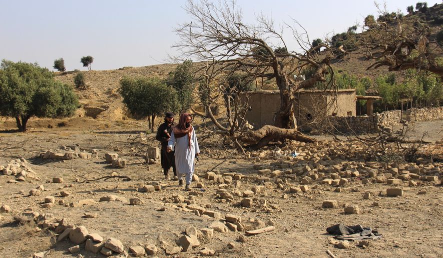 Taliban security officers inspect the scene of what Taliban officials said were Pakistani airstrikes in Khost province, Afghanistan, Thursday, Sept. 24, 2026. (AP Photo/Saifullah Zahir)