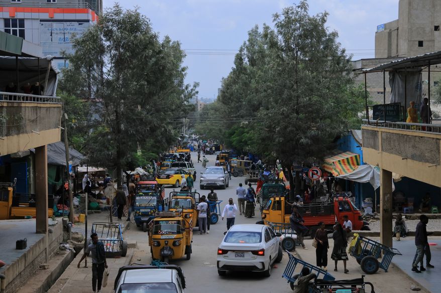 People walk in Mekelle, the capital of Ethiopia's Tigray region, as fighting escalates with the central government, Thursday, Sept. 24, 2026. (AP Photo)