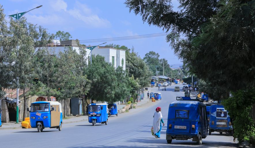 People walk in Mekelle, the capital of Ethiopia's Tigray region, as fighting escalates with the central government, Thursday, Sept. 24, 2026. (AP Photo)