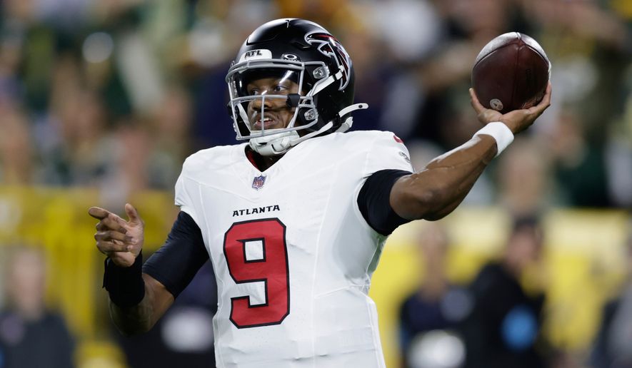 Atlanta Falcons' Michael Penix Jr. throws during the first half of an NFL football game against the Green Bay Packers in Green Bay, Wis., Thursday, Sept. 24, 2026. (AP Photo/Matt Ludtke)