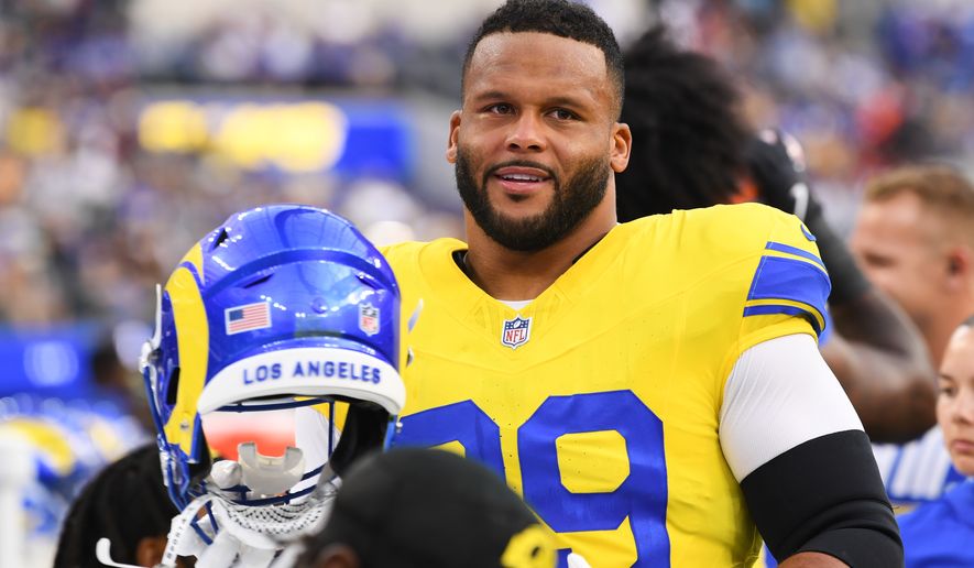 Los Angeles Rams defensive end Aaron Donald looks on from the bench before an NFL football game against the New York Giants in Inglewood, Calif., Monday, Sept. 21, 2026. (AP Photo/Katie Chin)