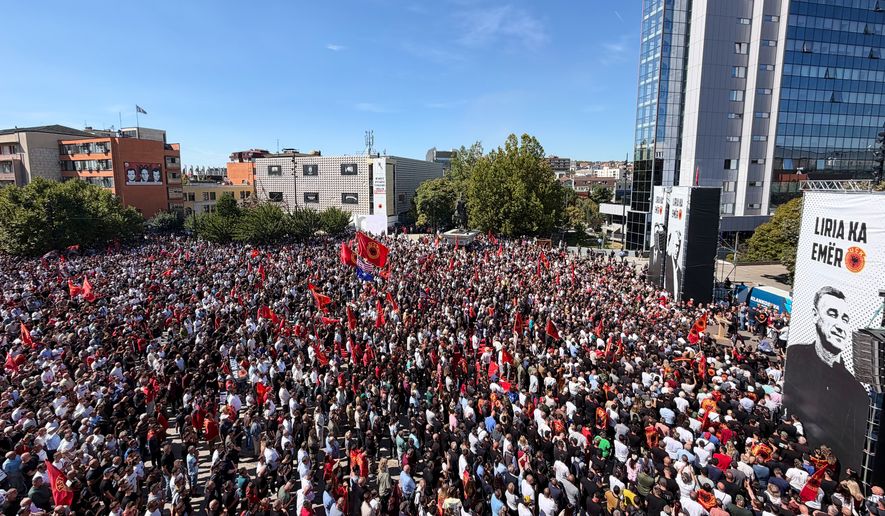 People gather in Pristina, Kosovo, Friday, Sept. 18, 2026, to protest against the verdicts for former Kosovo President Hashim Thaci and three other former Kosovo Liberation Army leaders, Kadri Veseli, Rexhep Selimi and Jakup Krasniqi, handed by a Netherlands-based court that tried them for alleged war crimes during the 1998-1999 war for independence from Serbia. (AP Photo/Zana Cimili)