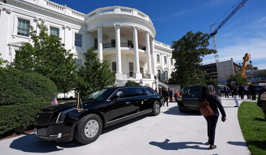 The motorcade of President Donald Trump departs the White House en route to the National Archives to greet China's President Xi Jinping and his wife Peng Liyuan, Friday, Sept. 25, 2026, in Washington. (AP Photo/Jacquelyn Martin)