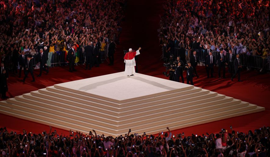 Pope Leo XIV waves after a prayer vigil with young people at the Stade de France in Saint-Denis near Paris, Friday, Sept. 25, 2026. (AP Photo/Thomas Padilla)