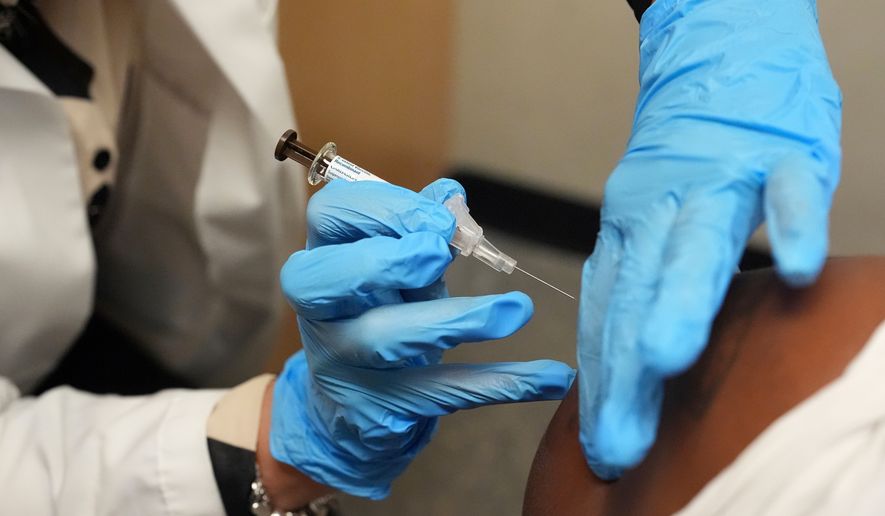 A patient receives a vaccine protecting against human papillomavirus (HPV) at a pharmacy in Miami, Sept. 9, 2025. (AP Photo/Rebecca Blackwell, File)