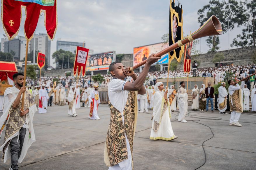 Members of an Orthodox choir perform during celebrations for the Orthodox holiday of Meskel, an annual holiday celebrating the discovery of the True Cross in the fourth century by the Roman Empress Helena, in Addis Ababa, Ethiopia, Saturday, Sept. 26, 2026. (AP Photo/Amanuel Sileshi)