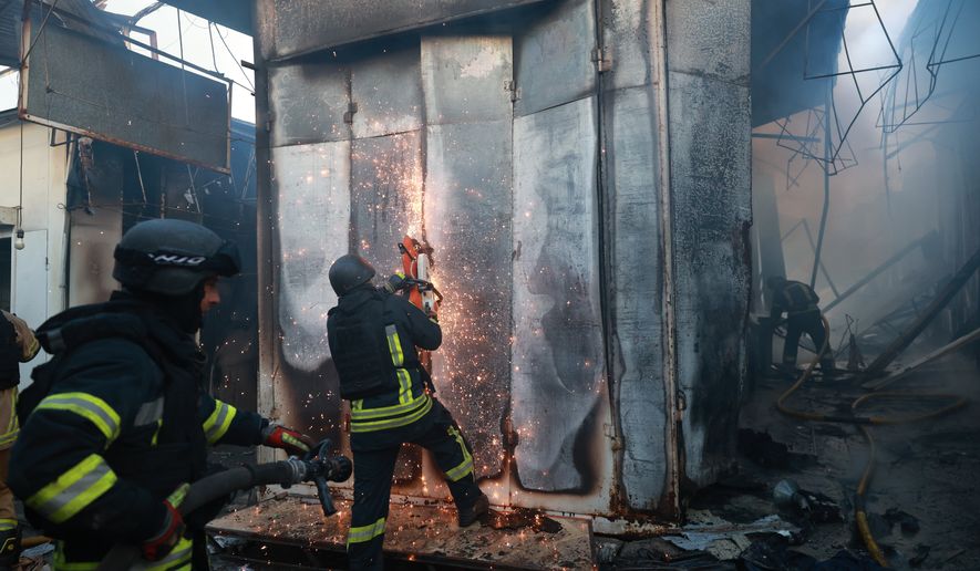 Rescuers work on a site of Russian drone strike on the central market of Zaporizhzhia, Ukraine, on Saturday, Sept. 26, 2026. (AP Photo/Kateryna Klochko)
