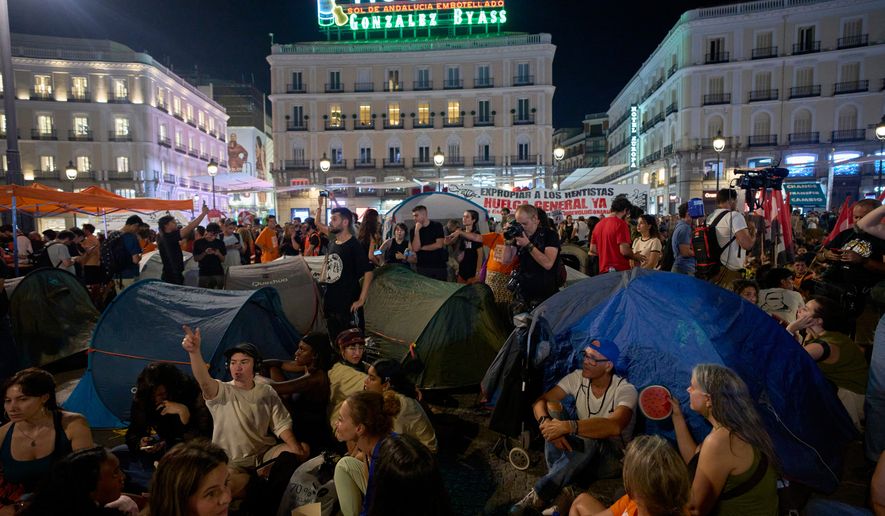 People set up tents during a protest following the eviction last Wednesday of 87-year-old Maricarmen to demand stronger laws to protect renters at Sol square in Madrid, Spain, Saturday, Sept. 26, 2026. (AP Photo/Manu Fernandez)