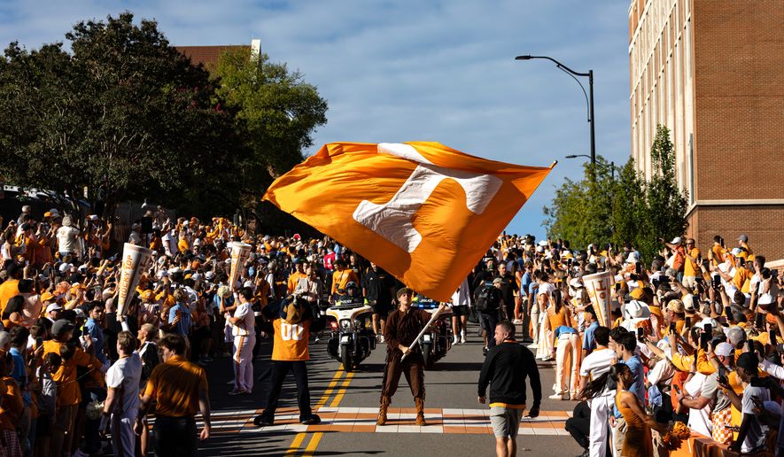 Tennessee mascot waves the Power T flag during the Vol Walk before an NCAA college football game between Tennessee and Texas, Saturday, Sept. 26, 2026, in Knoxville, Tenn. (AP Photo/Wade Payne)