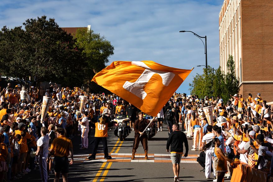 Tennessee mascot waves the Power T flag during the Vol Walk before an NCAA college football game between Tennessee and Texas, Saturday, Sept. 26, 2026, in Knoxville, Tenn. (AP Photo/Wade Payne)
