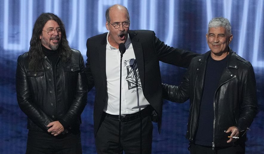 David Grohl, from left, Krist Novoselic, and Pat Smear of Nirvana accept the video vanguard award during the MTV Video Music Awards on Sunday, Sept. 27, 2026, at the Peacock Theater in Los Angeles. (AP Photo/Chris Pizzello)