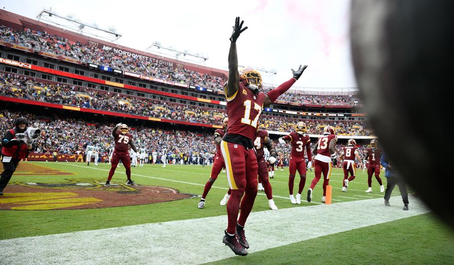 Washington Commanders wide receiver Terry McLaurin (17) celebrates his touchdown against Seattle Seahawks during the second half of an NFL football game Sunday, Sept. 27, 2026 in Landover, Md. (AP Photo/Nick Wass)